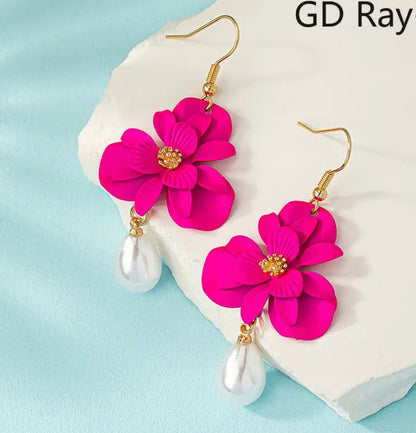 Caravanas flor fucsia