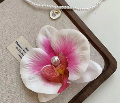 Pinza orquídea