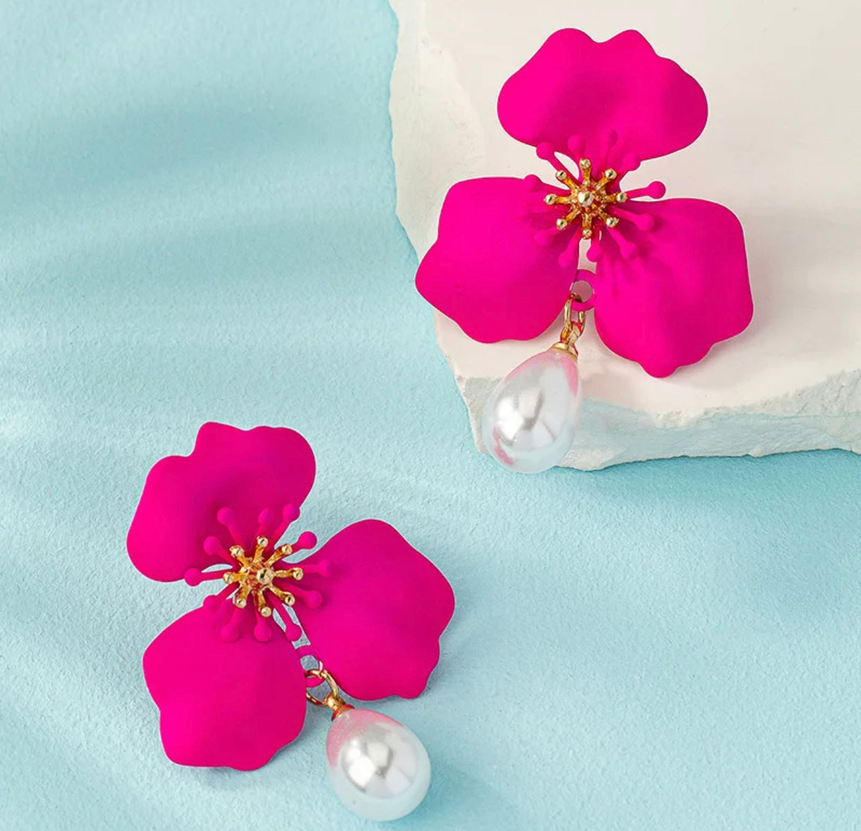 Caravanas flor fucsia