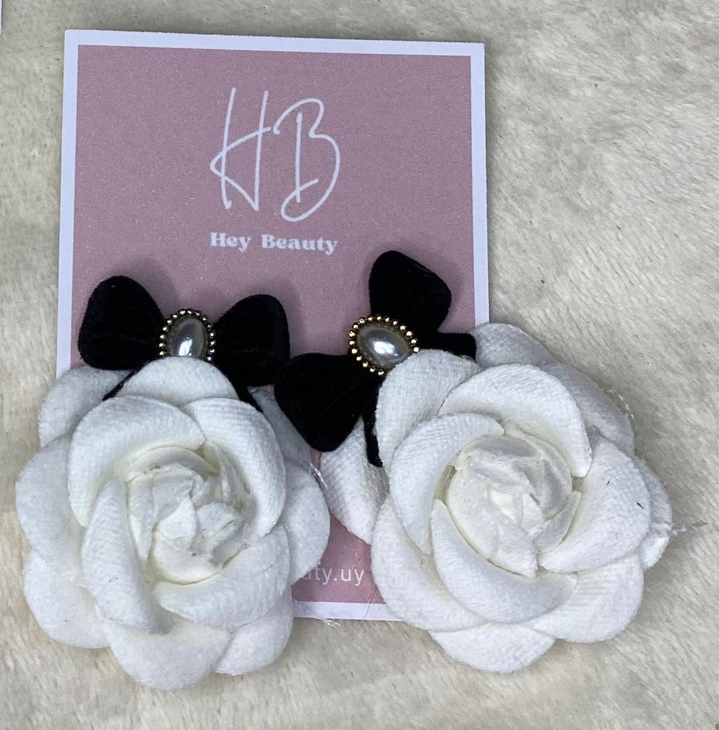 Caravana rosa blanca